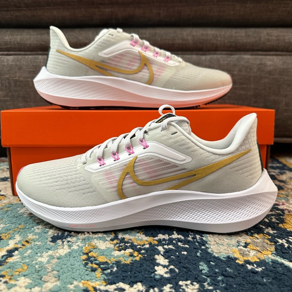 Nike Women’s Athletic Running Shoes in White with Gold and Pink Accents